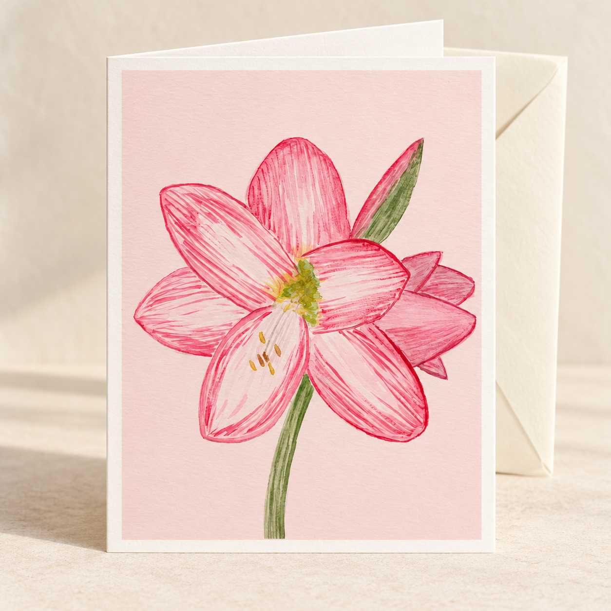 Holiday Amaryllis watercolor greeting card with an ivory envelope on a clean ivory background — artwork preview, not yet printed